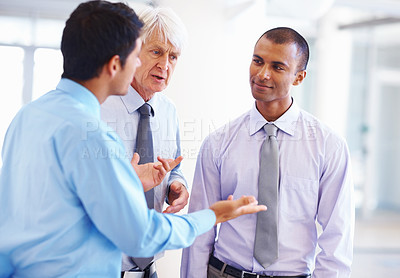 Buy stock photo Portrait of African American executive listening to other male professionals