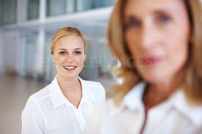 Buy stock photo Portrait of cute young business woman smiling with female executive at office