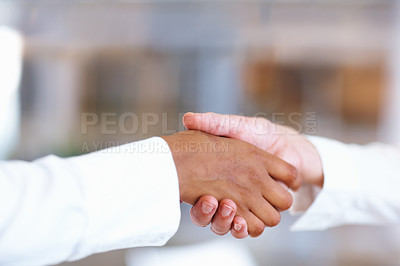 Buy stock photo Closeup of multiracial handshake between two business men