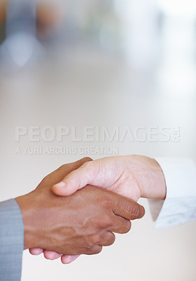 Buy stock photo Closeup of two business executives shaking hands with each other