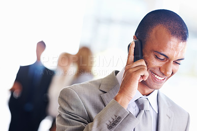 Buy stock photo Closeup of African American business man on call with executives in background