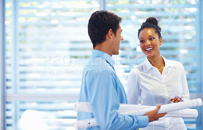 Buy stock photo Portrait of happy young architects talking to each other at office