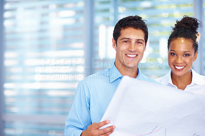 Buy stock photo Portrait of good looking architects smiling with blueprints