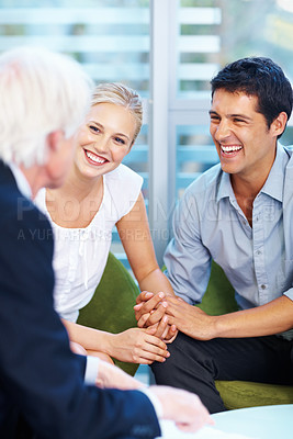 Buy stock photo Portrait of young couple having good time with financial advisor