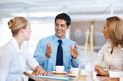 Buy stock photo Portrait of young business man expressing his views in meeting with female executives