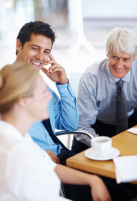 Buy stock photo Portrait of senior and junior male executives smiling while looking at business woman