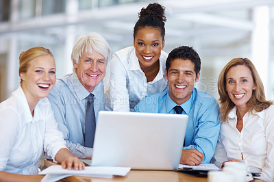 Buy stock photo Portrait of smiling multi racial business people working on laptop at office