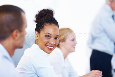 Buy stock photo Closeup of African American business woman smiling with colleagues in meeting