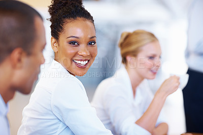 Buy stock photo Closeup of African American executive smiling with business people in meeting
