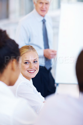 Buy stock photo Portrait of pretty young business woman smiling with team in meeting