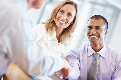 Buy stock photo Portrait of young business man shaking hands with associate at office