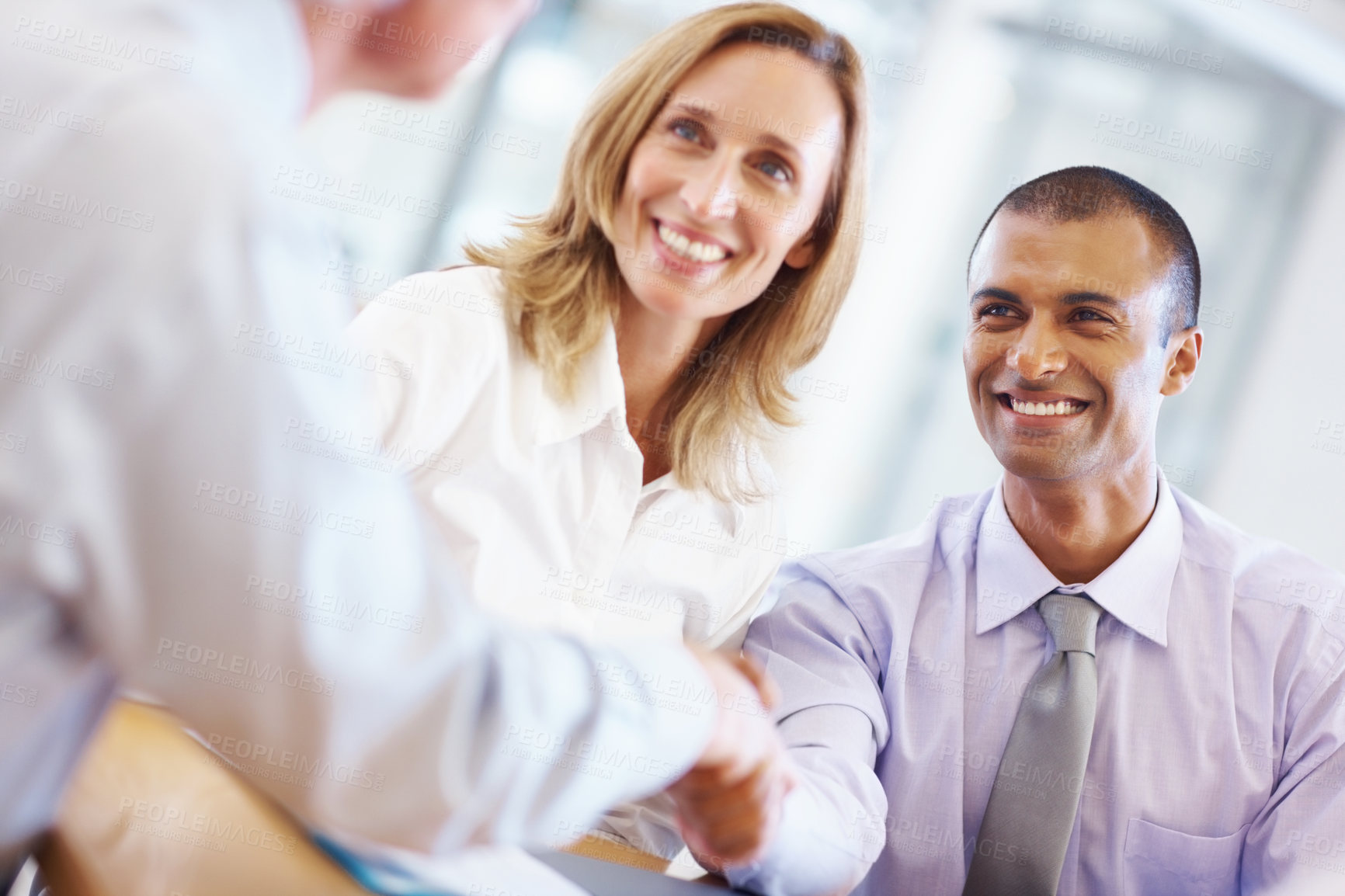 Buy stock photo Portrait of young business man shaking hands with associate at office