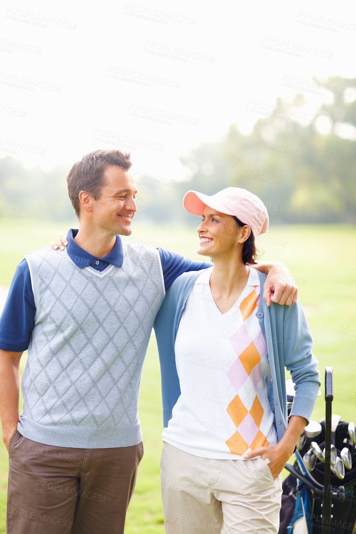 Buy stock photo Smile, support and couple on golf course for game, outdoor fun and fitness on weekend morning. Love, happy woman and man on green grass for romantic sports date, health and wellness with exercise.