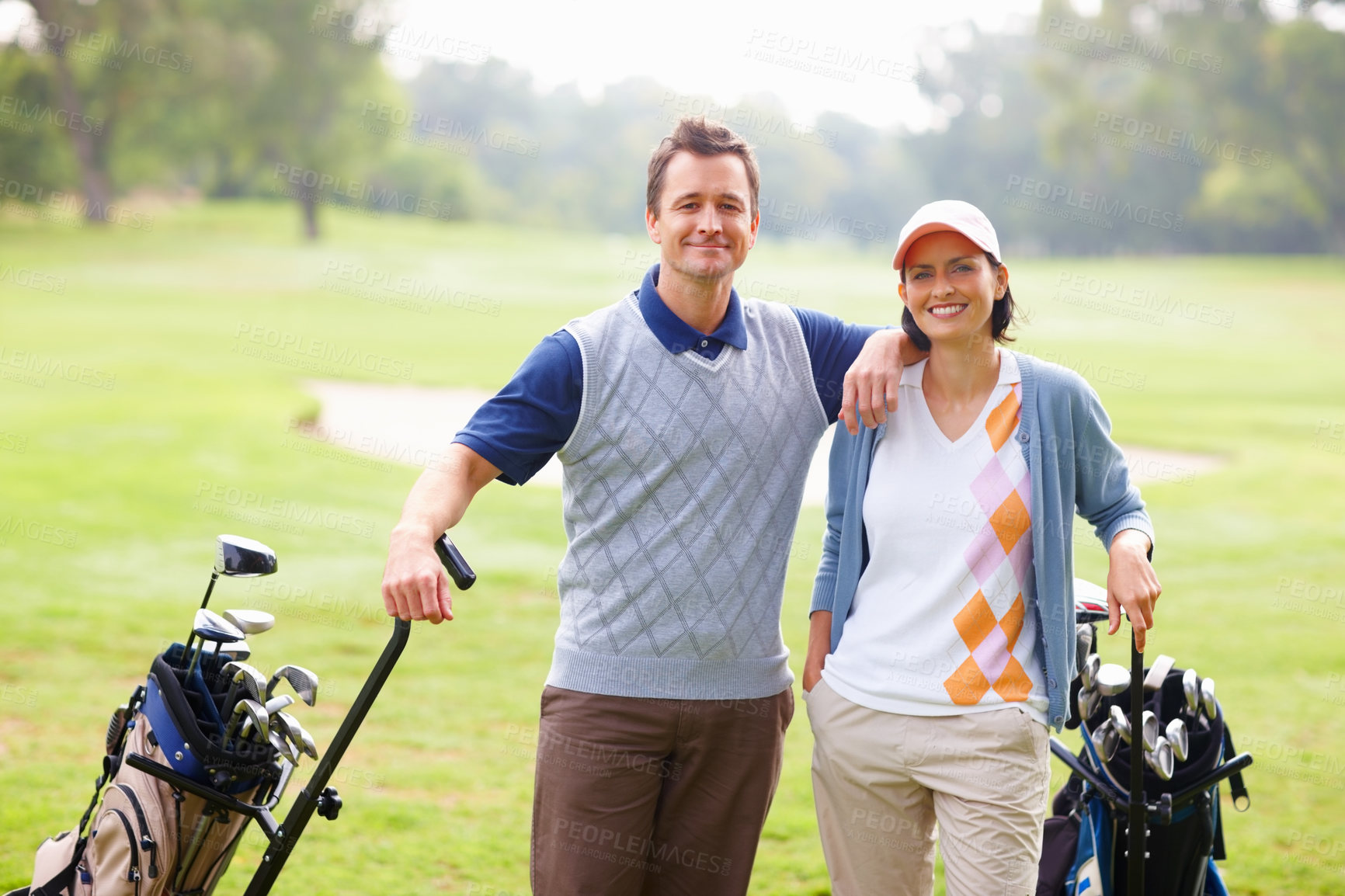 Buy stock photo Portrait, golf course and couple with training, smile and grass field with sports, recreation and health. Face, man and woman with wellness, activity and happiness with fitness, routine and hobby