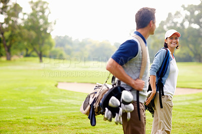 Buy stock photo Focus on female golfer smiling and looking at man