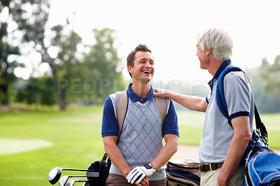 Buy stock photo Father, son and happy on course for golf, bonding and sports outdoor with equipment bag or conversation. Elderly person, man and smile on grass for hobby, talking and playing game at country club