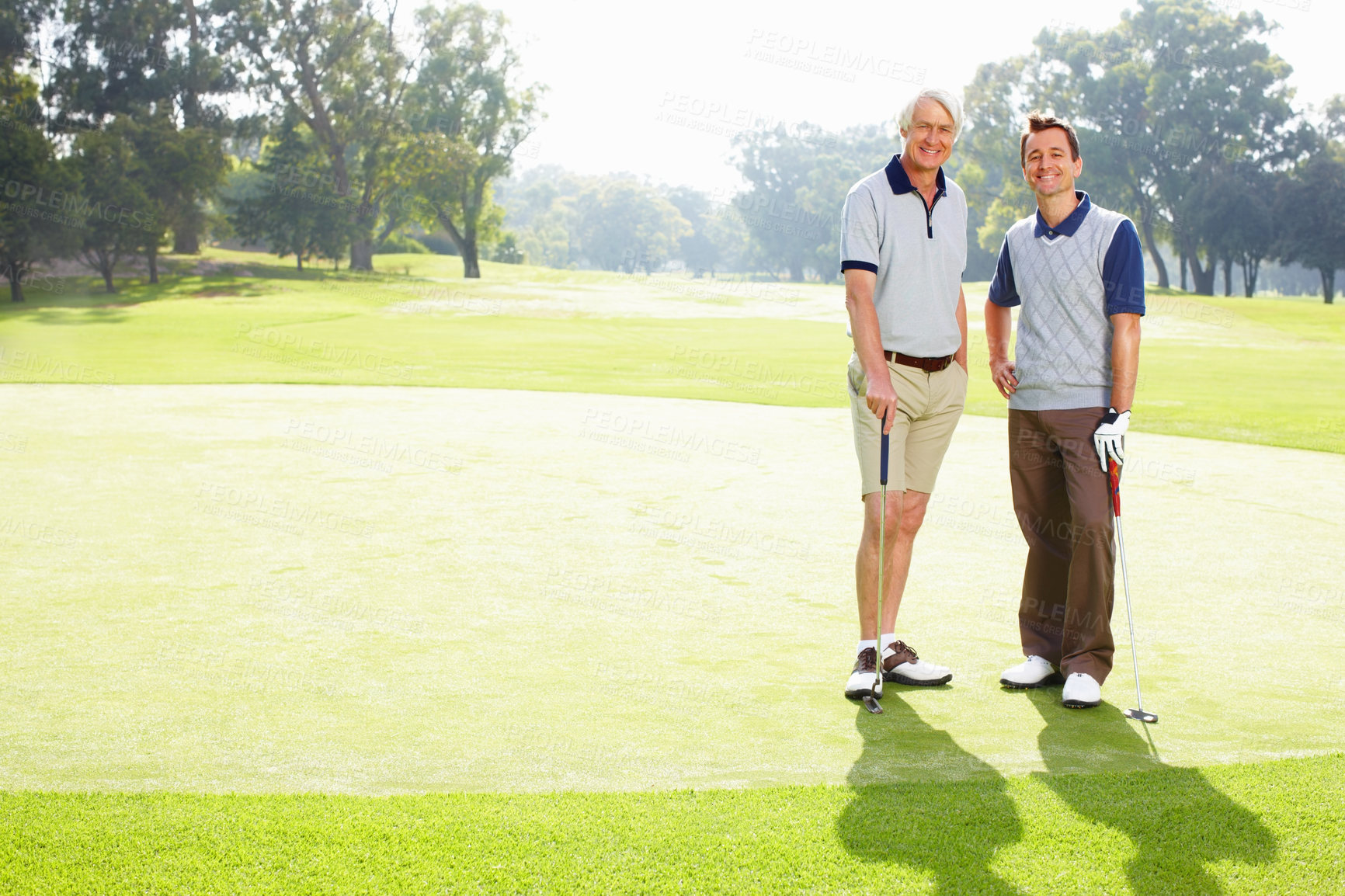 Buy stock photo Portrait, golf course and father with son, health and grass field with fitness, recreation and sports. Face, family or people with wellness, nature or happy men with training, routine or hobby