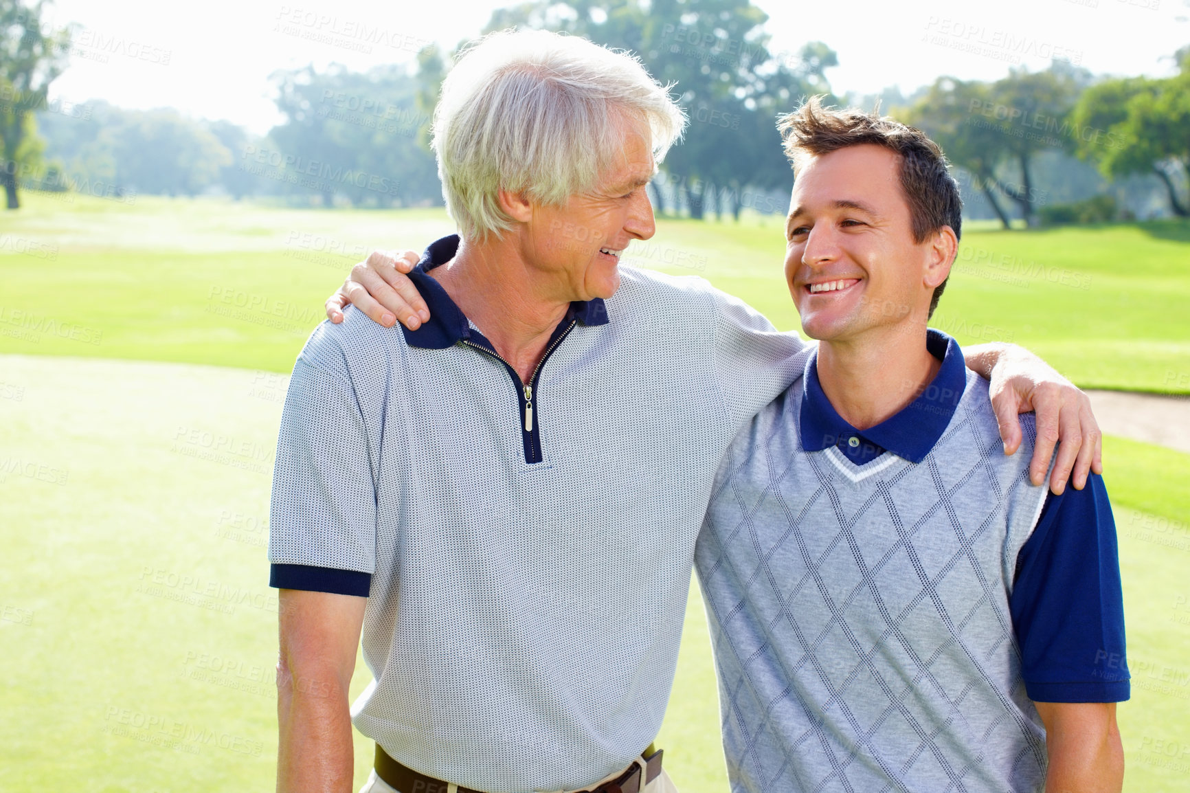 Buy stock photo Smile, senior man and son on hug on golf course together for teamwork, outdoor fun and fitness competition. Sports, embrace and friends on green for partnership, bonding and support for hobby in USA