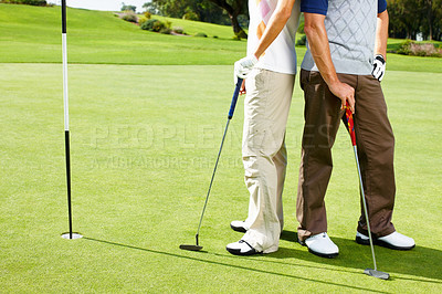 Buy stock photo Legs, hole and people on golf course together for teamwork, outdoor fun and fitness competition. Sports, partnership and team on green for bonding, challenge and support in healthy hobby in Portugal