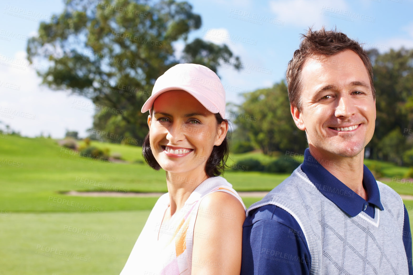 Buy stock photo Closeup of golfing couple giving you a cute smile