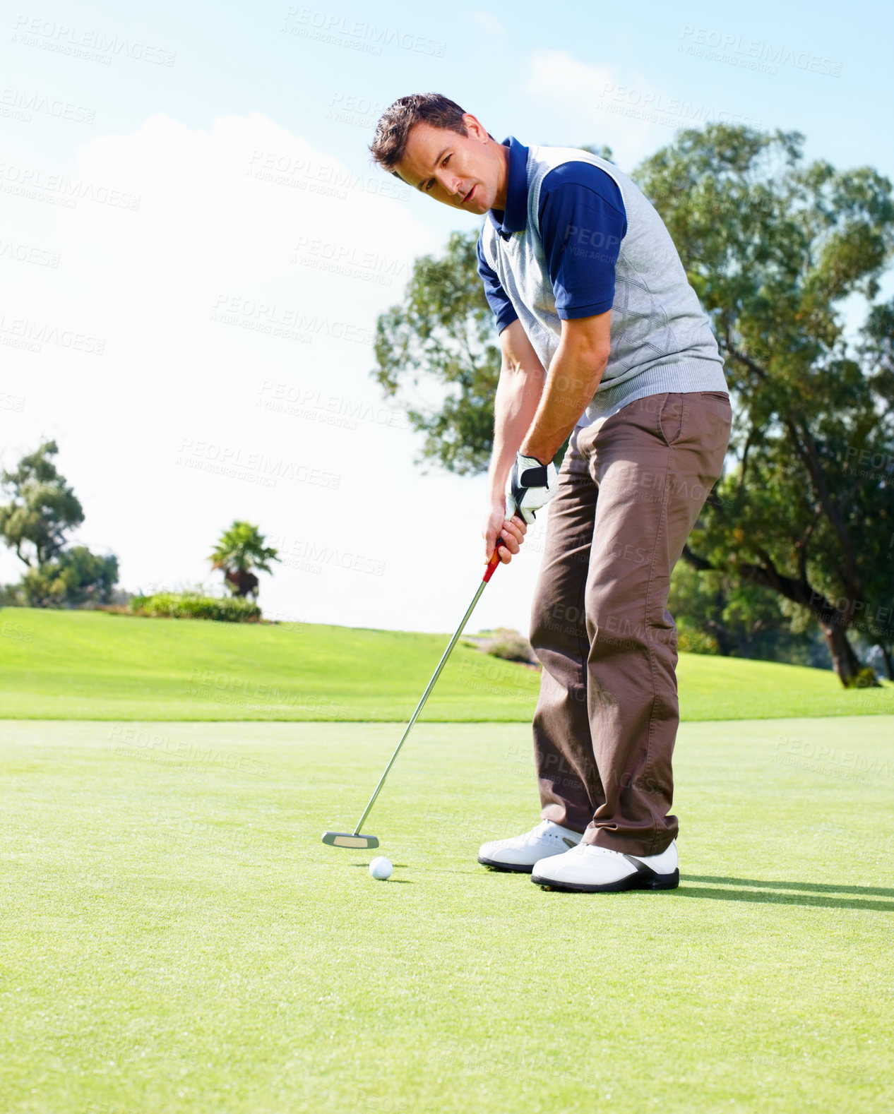 Buy stock photo Man, putting and golf course for hole, sports and outdoor fitness for competition or games. Male person, tournament and precision ball for practice match on turf, exercise and professional athlete