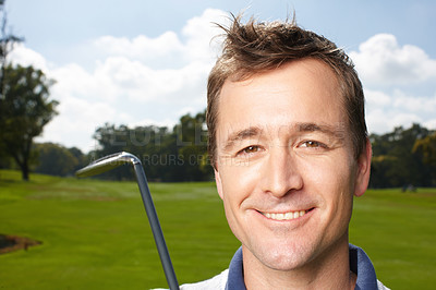 Buy stock photo Smiling mature man holding his golf club while on the course - closeup