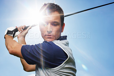 Buy stock photo Sports, golf club and man with swinging for match, training and practice for tournament game. Mockup, male person or serious golfer with skills for championship, coordination and playing by blue sky