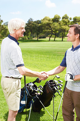 Buy stock photo Smile, shaking hands and men on golf course together for teamwork, congratulations or fitness competition. Handshake, senior father and son on green for partnership, bonding or support at sports club