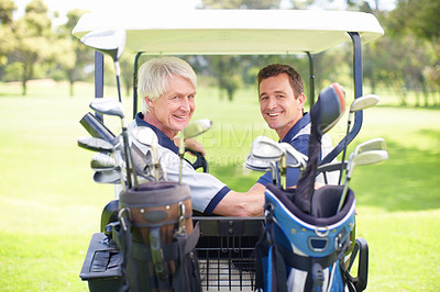 Buy stock photo Golfing companions on the golf course in a golf cart