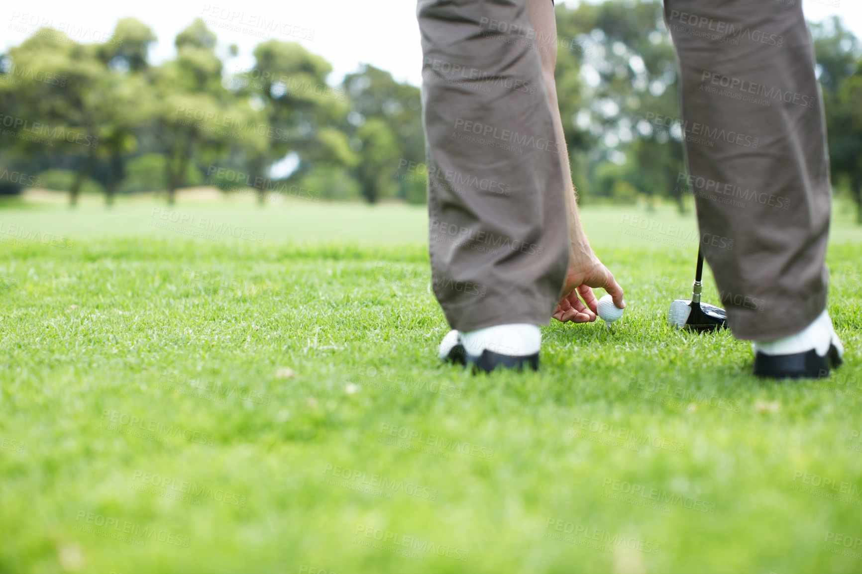 Buy stock photo Tee, game and hands of man on golf course for outdoor exercise, fitness and challenge in morning. Sports, play and professional golfer on green grass for competition, health and wellness in nature