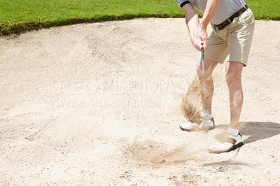 Buy stock photo Bunker, swing and man on golf course with hit for outdoor exercise, fitness and challenge in morning. Sports, play and professional golfer with dust in sand for game, ball and competition in nature