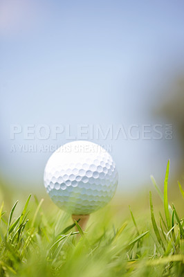 Buy stock photo Shot of a golf ball out on the course 