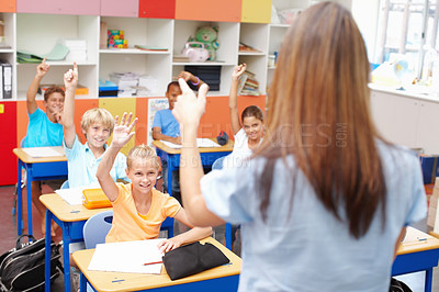 Buy stock photo Question, children and answer teacher in classroom for learning, assessment and education support. Smart students, lesson and hands raised with knowledge, exam quiz and feedback at elementary school