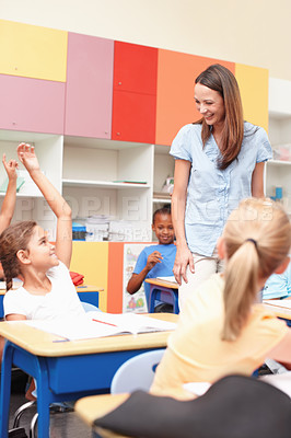 Buy stock photo Woman, question and kids with hands raised in class for learning, discussion and choice for answer. Happy, teacher and child students with gesture at school for education, participation and solution