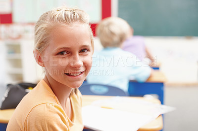 Buy stock photo Smile, portrait and girl at desk in classroom for learning, growth and child development in education. Happy, face and student in school for knowledge, study and future opportunity with scholarship.