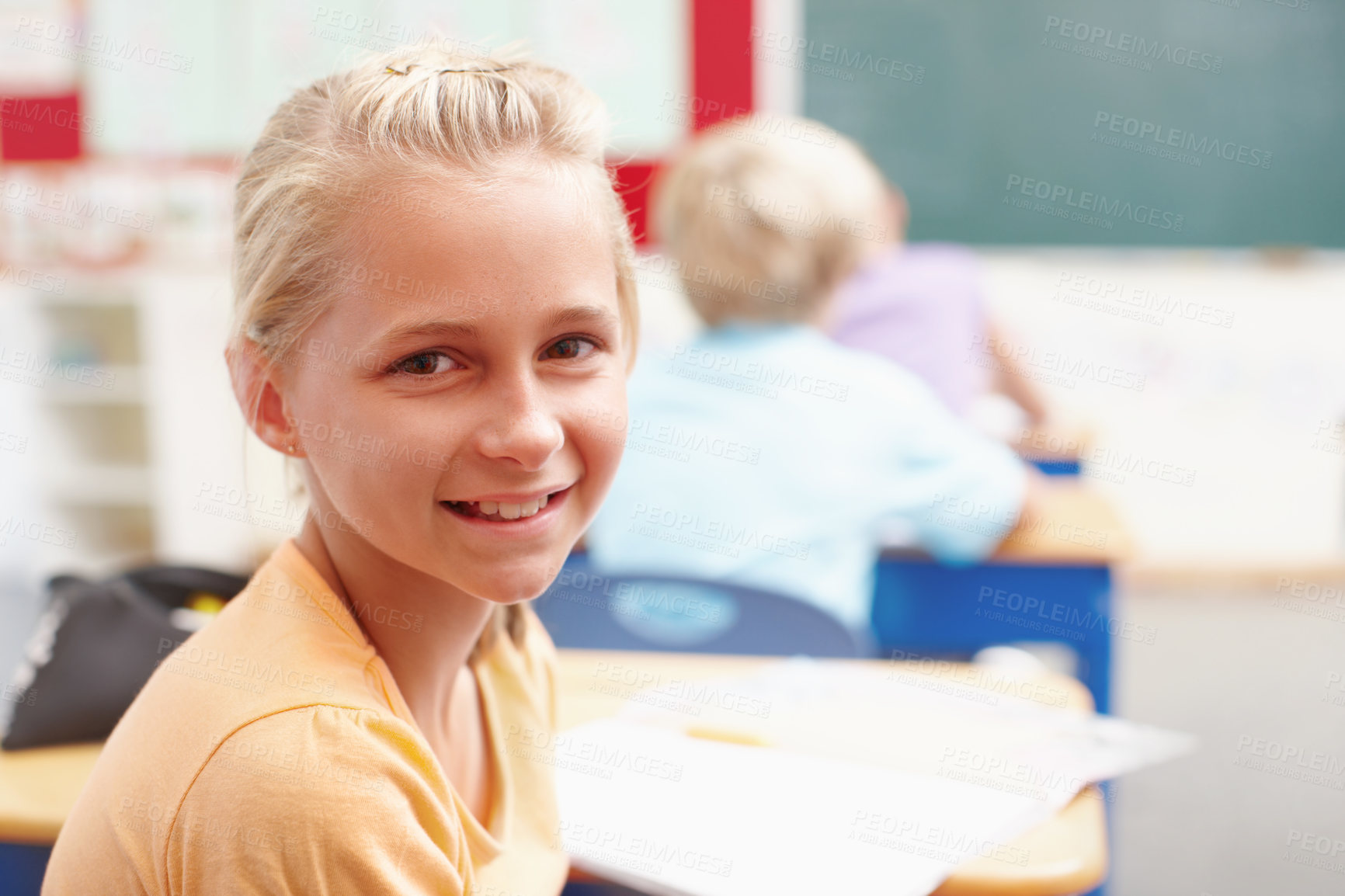 Buy stock photo Smile, portrait and girl at desk in classroom for learning, growth and child development in education. Happy, face and student in school for knowledge, study and future opportunity with scholarship.