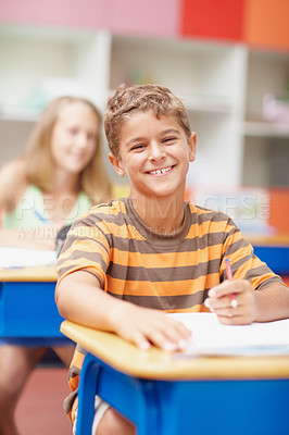 Buy stock photo School, books and portrait of child in classroom for learning, education and lesson for development. Happy, academy and young boy with stationery for writing, creativity and assignment for knowledge