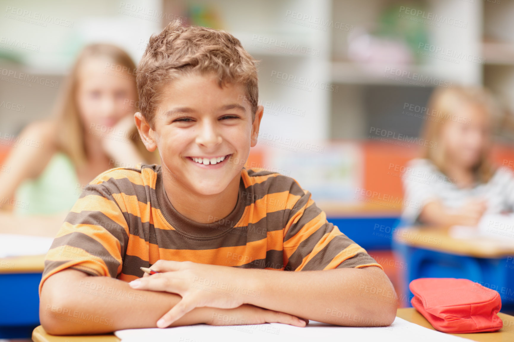 Buy stock photo Happy, portrait and boy in kids classroom for learning, growth and child development at elementary school. Smile, face and student at desk for education, study and future opportunity for scholarship.