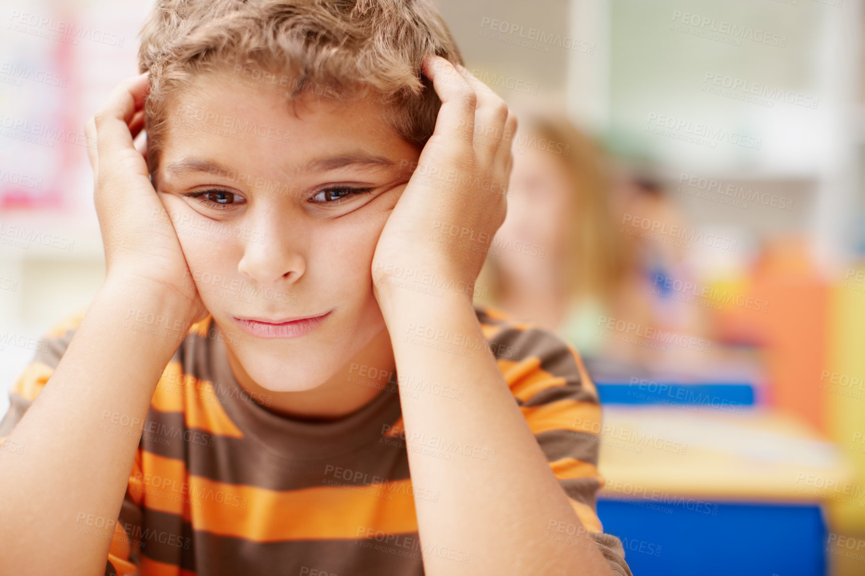 Buy stock photo Student, boy and thinking in classroom at school for education, teaching and learning. Learner, hands on face and thoughts or bored in elementary phase for exam, assessment and brain development