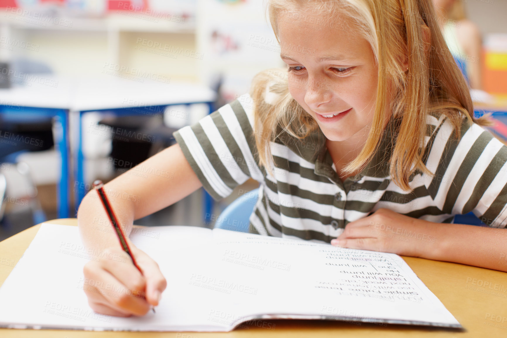 Buy stock photo Writing, books and child in class for education, learning and lesson for development. Primary school, academy and young girl with stationery for practice, assignment and language test for knowledge