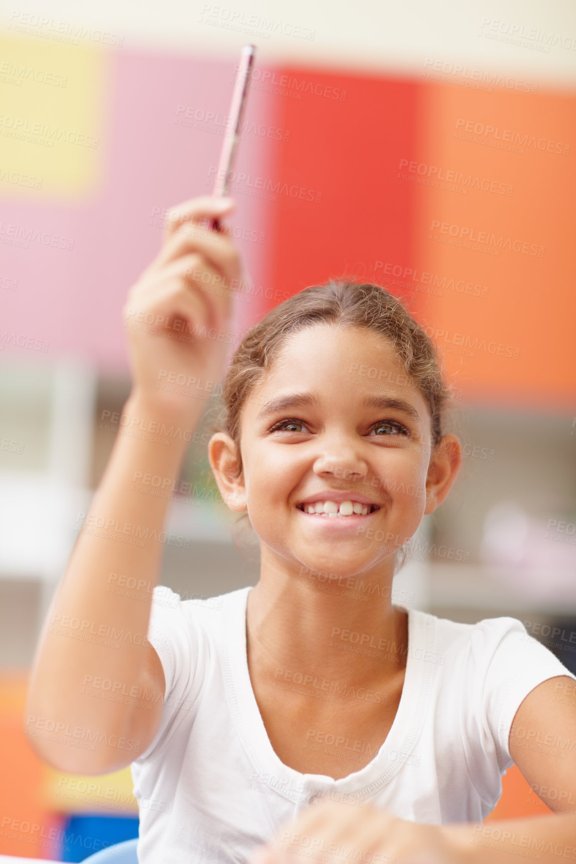 Buy stock photo Question, student and answer in classroom for education, assessment and learning scholarship with smile. Smart girl, lesson and hands raised with knowledge, exam test or feedback at elementary school