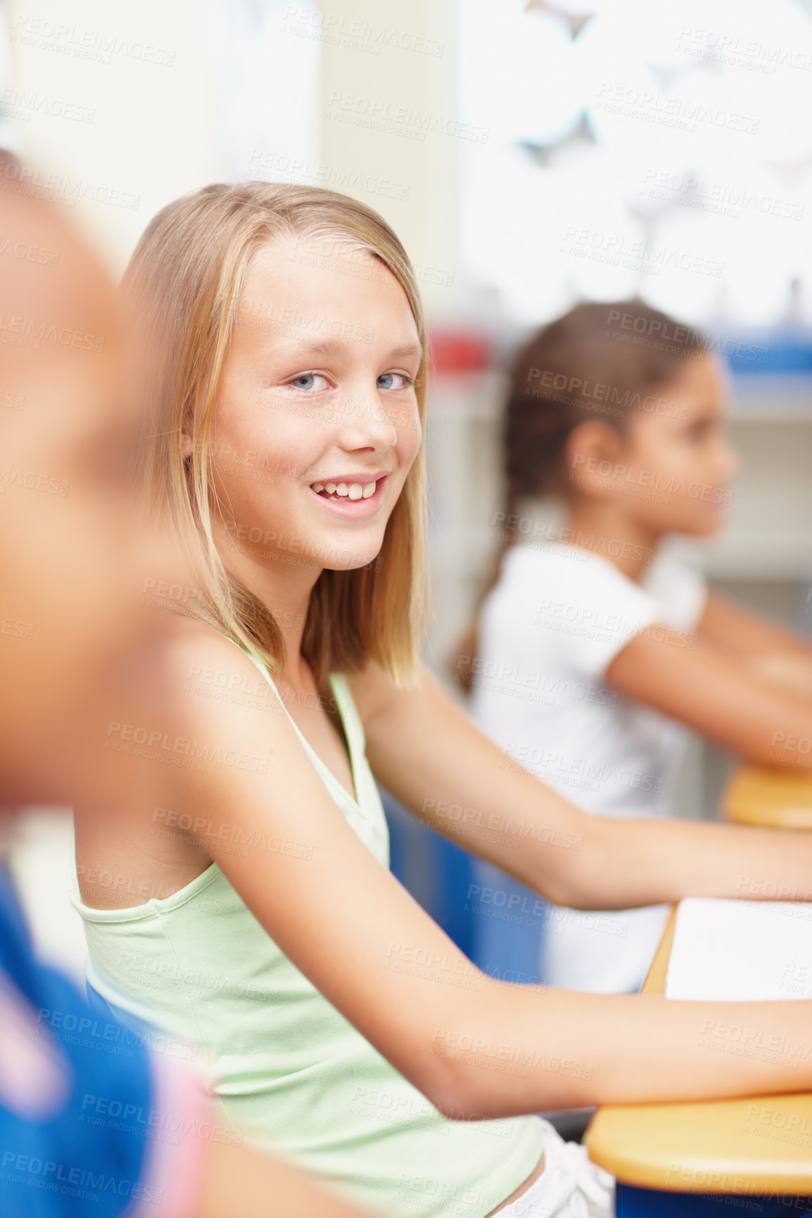 Buy stock photo Smile, portrait and girl in class for lesson, growth and child development at elementary school. Happy, face and student at desk for kids education, writing test and assessment for scholarship.