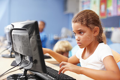 Buy stock photo A cute schoolgirl in computer class