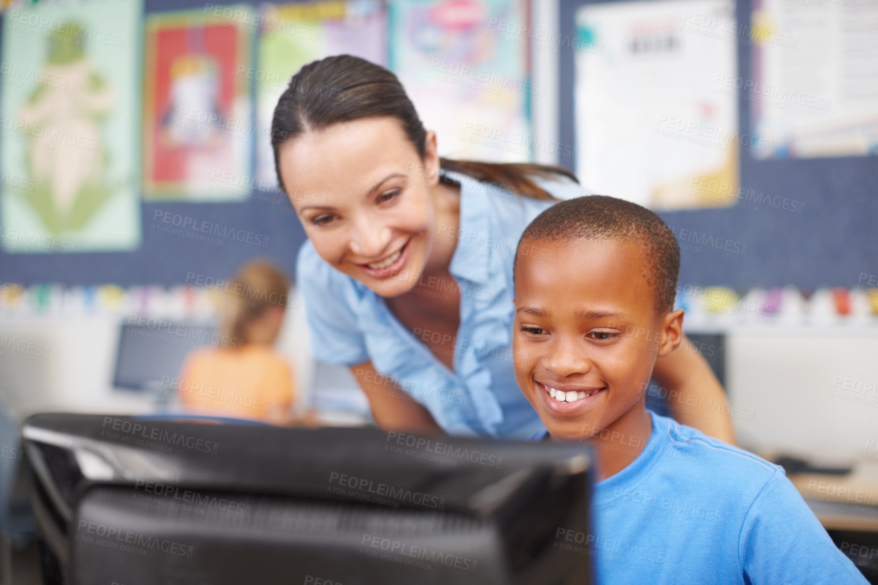 Buy stock photo Woman, teacher and boy with teaching on computer in classroom for lesson, help and learning. People, educator and happy with student at elementary school for education, support and brain development