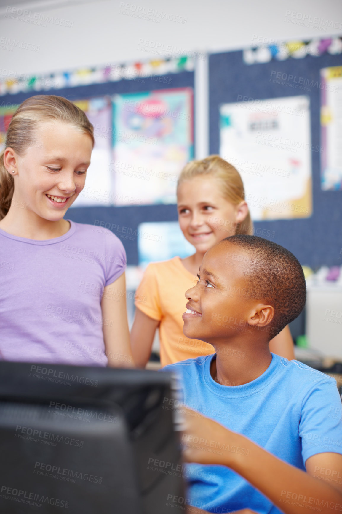 Buy stock photo Kids, students and smile in classroom on computer with group work or activity for education. People, classmates and  happy as pupil at elementary school for assignment, brain development and growth