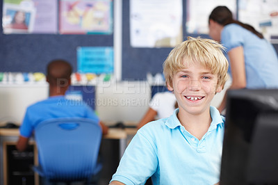 Buy stock photo Portrait of a young schoolboy in computer class