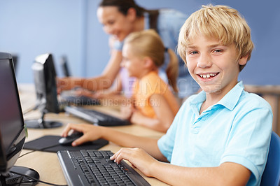 Buy stock photo Portrait of a young schoolboy working in computer class
