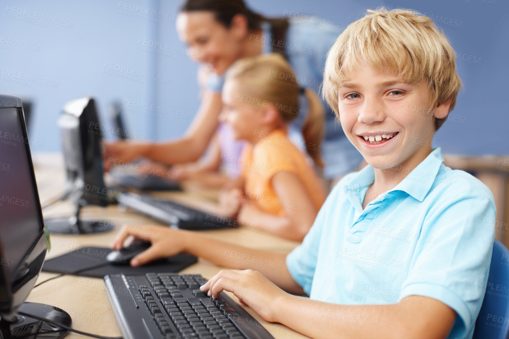 Buy stock photo Portrait of a young schoolboy working in computer class