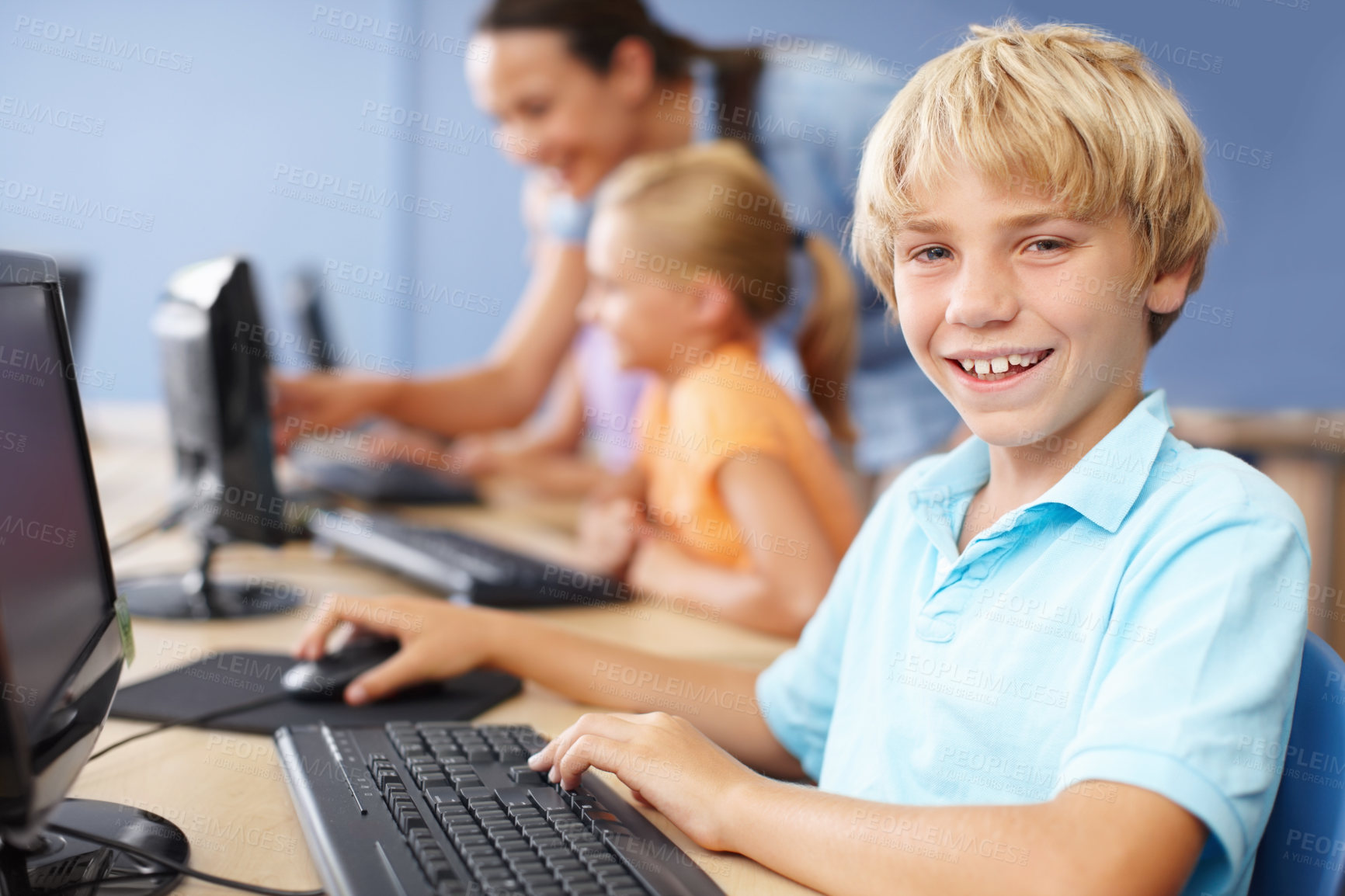 Buy stock photo Computer, education and portrait of happy boy student in classroom of school for learning or study. Child development, desk and smile with learner kid in class for future, growth or scholarship