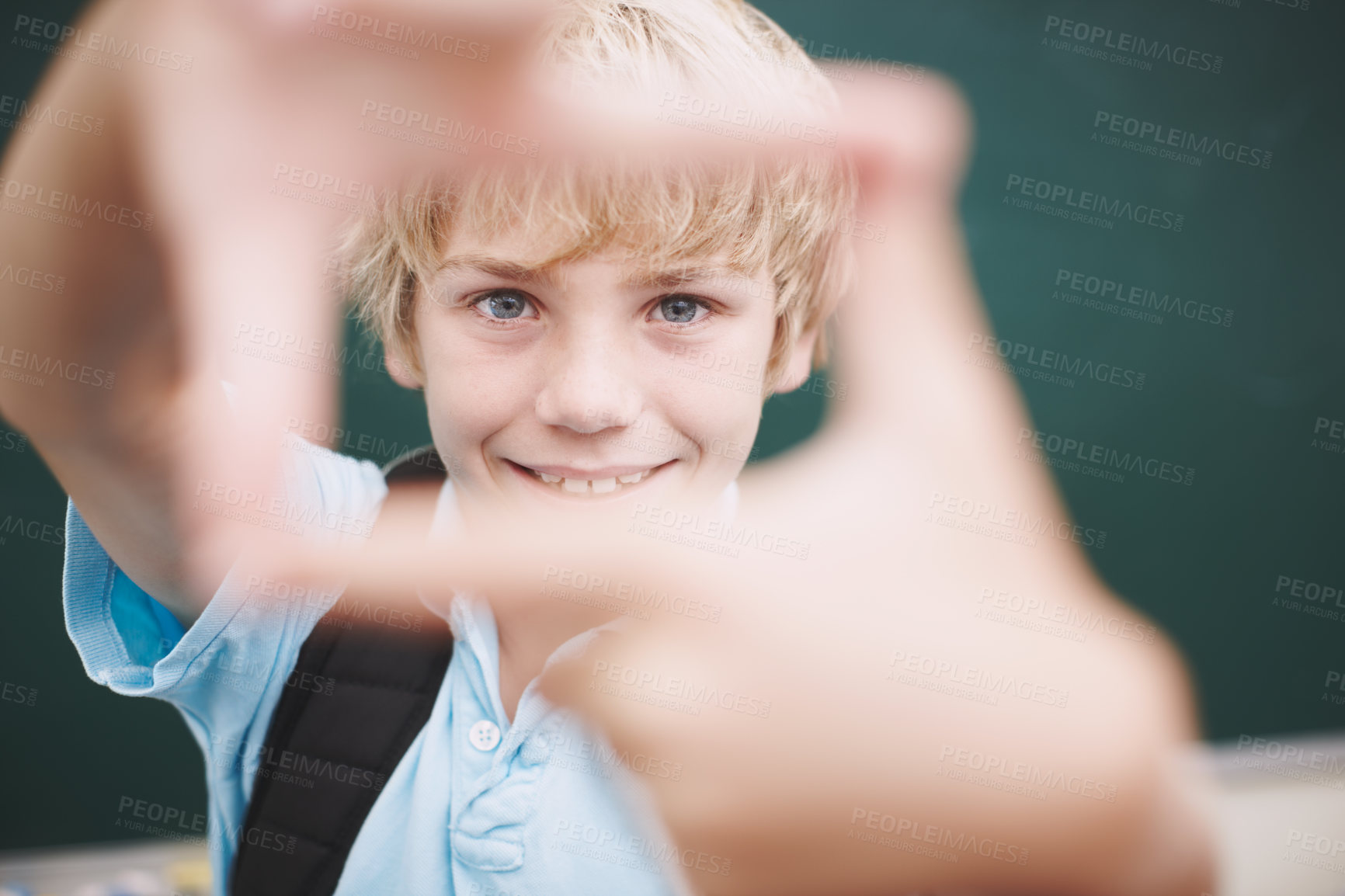 Buy stock photo Chalkboard, finger frame and portrait of boy in classroom at school for development or education. Learning, smile and study with happy student in academic class for future, growth or scholarship